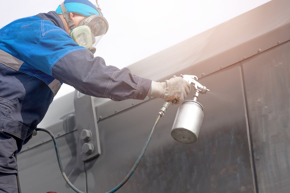 Foundation waterproofing Foundation waterproofing: Spraying a liquid waterproofing membrane on a foundation wall